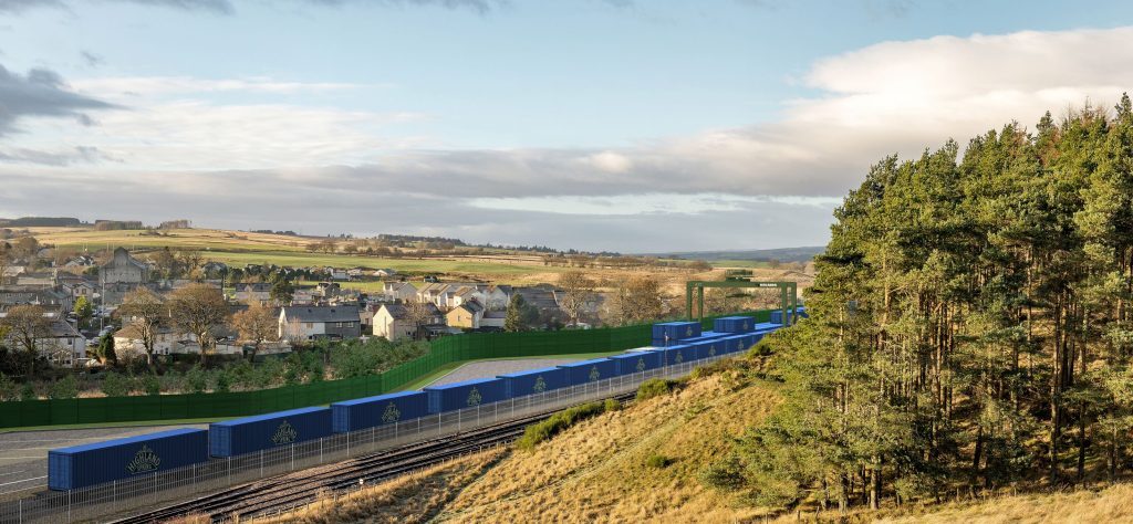 blue coloured rail freight cars docked at the rail freight facility.